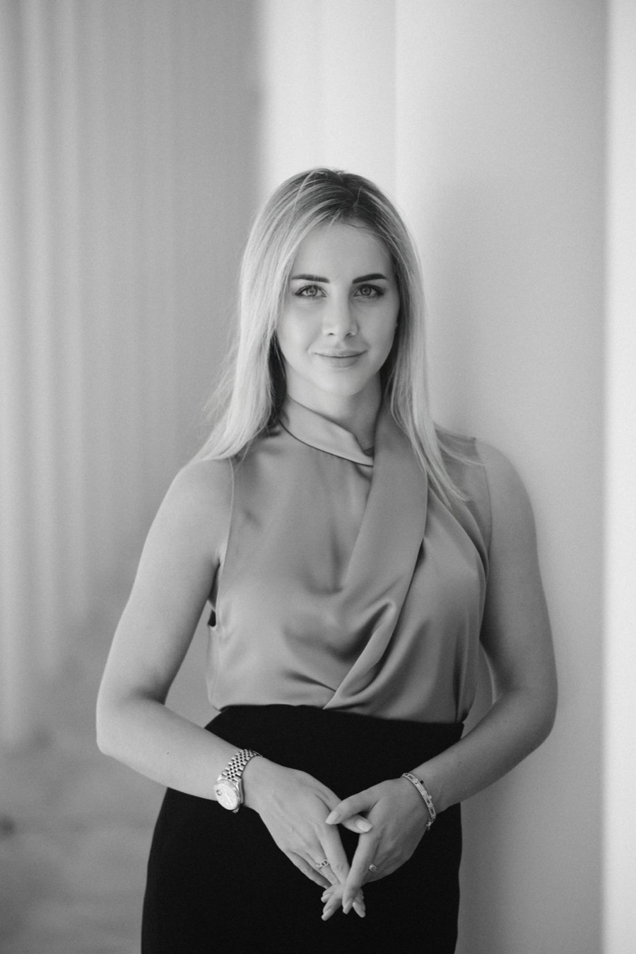 Anna Albu, photographed in three-quarter framing against a pale studio ground.